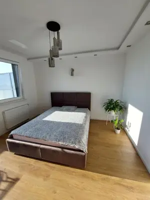 Łóżko lub łóżka w pokoju w obiekcie Sunset Apartament