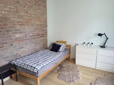 Łóżko lub łóżka w pokoju w obiekcie Lemuria Hostel Wrocławska centrum