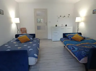 Łóżko lub łóżka w pokoju w obiekcie Apartament przy Papierni