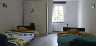 Łóżko lub łóżka w pokoju w obiekcie Apartament przy Papierni