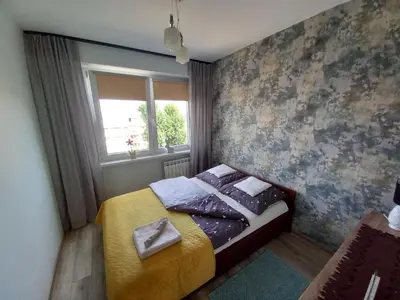 Łóżko lub łóżka w pokoju w obiekcie Apartamenty A&B Silver