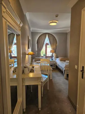 Łóżko lub łóżka w pokoju w obiekcie Hotel Adler