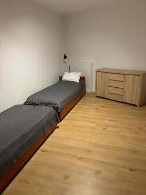 Łóżko lub łóżka w pokoju w obiekcie Cicha 2A
