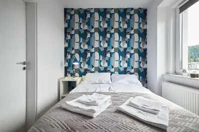 Łóżko lub łóżka w pokoju w obiekcie Blue Apartament & Office Kudowa-Zdrój