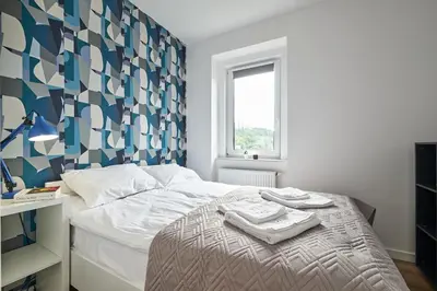 Łóżko lub łóżka w pokoju w obiekcie Blue Apartament & Office Kudowa-Zdrój