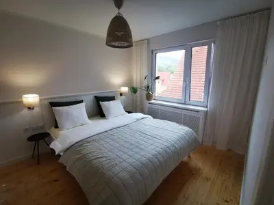 Łóżko lub łóżka w pokoju w obiekcie Leśniczówka