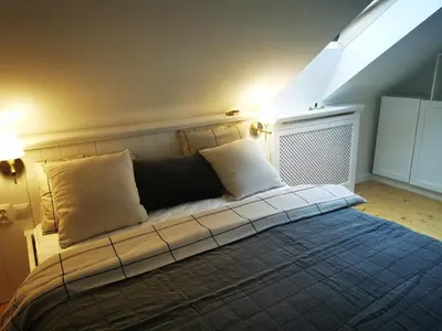 Łóżko lub łóżka w pokoju w obiekcie Leśniczówka