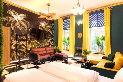Łóżko lub łóżka w pokoju w obiekcie Jungle Apartments Podwale