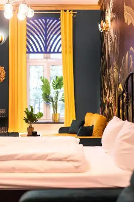 Łóżko lub łóżka w pokoju w obiekcie Jungle Apartments Podwale