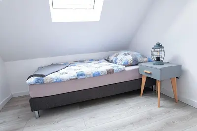 Łóżko lub łóżka w pokoju w obiekcie Apartamenty na Skraju