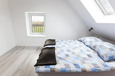 Łóżko lub łóżka w pokoju w obiekcie Apartamenty na Skraju