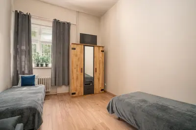 Łóżko lub łóżka w pokoju w obiekcie AS Home 9-osobowy apartament w Rynku