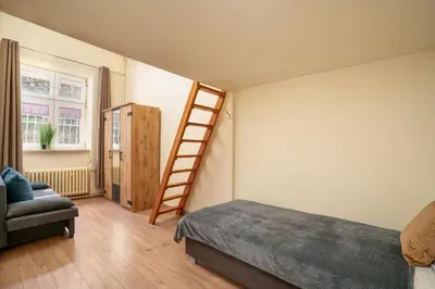 Łóżko lub łóżka w pokoju w obiekcie AS Home 9-osobowy apartament w Rynku