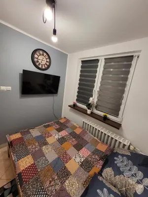 Łóżko lub łóżka w pokoju w obiekcie Apartament Leon