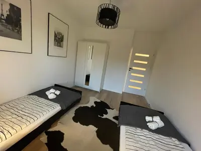 Łóżko lub łóżka w pokoju w obiekcie Apartament Park Poezji