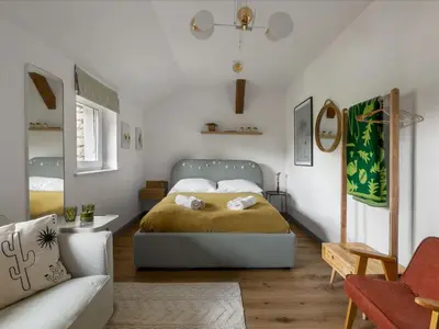 Łóżko lub łóżka w pokoju w obiekcie Apartament przy Stawie Zdrojowym