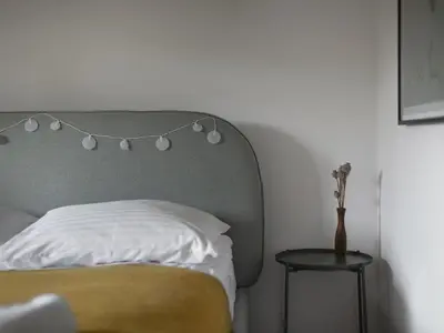 Łóżko lub łóżka w pokoju w obiekcie Apartament przy Stawie Zdrojowym