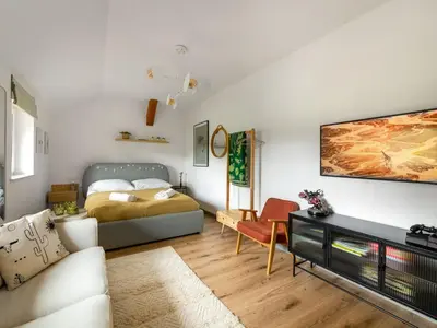 Łóżko lub łóżka w pokoju w obiekcie Apartament przy Stawie Zdrojowym