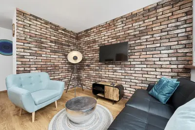 Telewizja i/lub zestaw kina domowego w obiekcie Stylish Kwiska Apartment Wrocław by Noclegi Renters