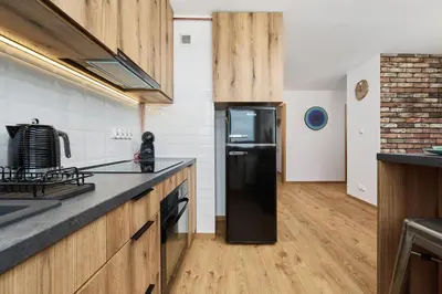 Kuchnia lub aneks kuchenny w obiekcie Stylish Kwiska Apartment Wrocław by Noclegi Renters