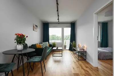 Łóżko lub łóżka w pokoju w obiekcie Apartment Olympia