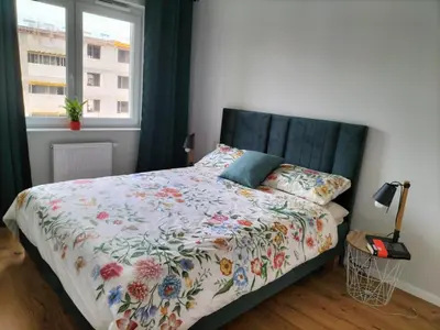 Łóżko lub łóżka w pokoju w obiekcie Apartment Olympia
