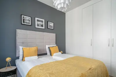 Łóżko lub łóżka w pokoju w obiekcie RentPlanet - Apartamenty Młyn Maria