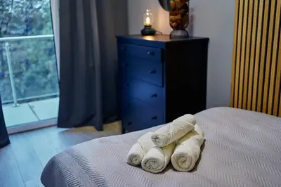 Łóżko lub łóżka w pokoju w obiekcie LAGUNA Apartament Polanica Residence 57