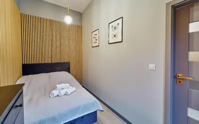 Łóżko lub łóżka w pokoju w obiekcie LAGUNA Apartament Polanica Residence 57