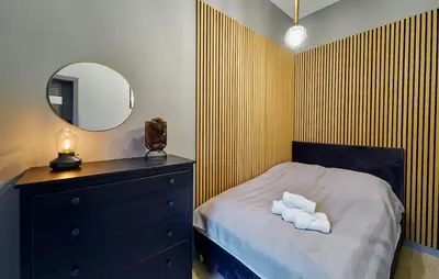 Łóżko lub łóżka w pokoju w obiekcie LAGUNA Apartament Polanica Residence 57