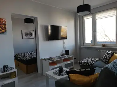 Telewizja i/lub zestaw kina domowego w obiekcie Bursztynowy Apartament