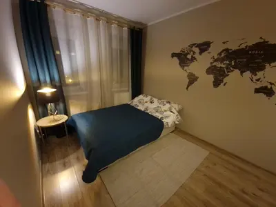 Łóżko lub łóżka w pokoju w obiekcie 91WrocLove Apartaments