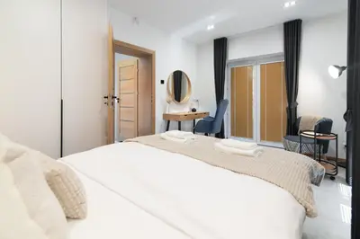 Łóżko lub łóżka w pokoju w obiekcie Apartamenty Obora