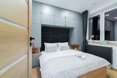 Łóżko lub łóżka w pokoju w obiekcie Apartamenty Obora