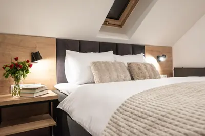 Łóżko lub łóżka w pokoju w obiekcie Apartamenty Obora