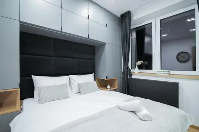 Łóżko lub łóżka w pokoju w obiekcie Apartamenty Obora