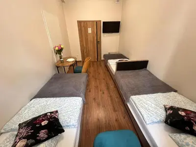 Łóżko lub łóżka w pokoju w obiekcie Hostel KASZUBSKA