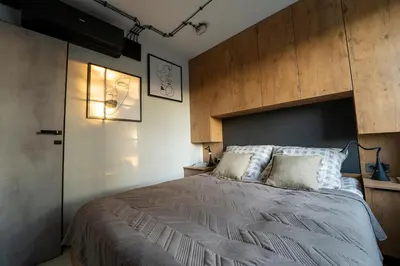 Łóżko lub łóżka w pokoju w obiekcie Industrial Apartment 