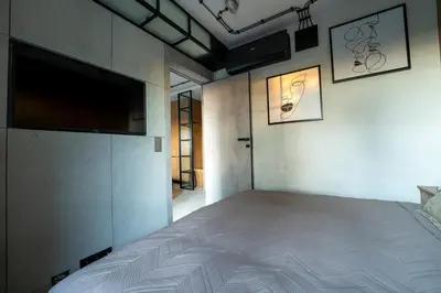 Łóżko lub łóżka w pokoju w obiekcie Industrial Apartment 