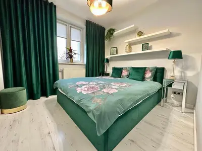 Łóżko lub łóżka w pokoju w obiekcie LuxApart Kalisz New
