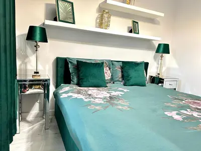 Łóżko lub łóżka w pokoju w obiekcie LuxApart Kalisz New