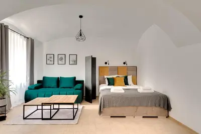 Łóżko lub łóżka w pokoju w obiekcie Apartament na parterze 40 m od rynku