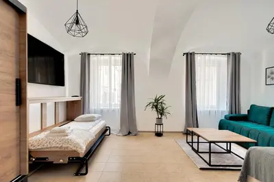 Łóżko lub łóżka w pokoju w obiekcie Apartament na parterze 40 m od rynku