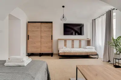 Łóżko lub łóżka w pokoju w obiekcie Apartament na parterze 40 m od rynku