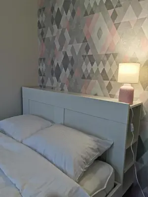 Łóżko lub łóżka w pokoju w obiekcie Apartament Manhattan