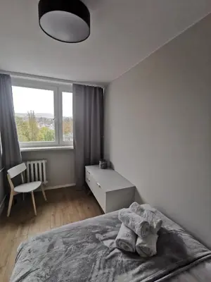 Łóżko lub łóżka w pokoju w obiekcie Apartament Manhattan