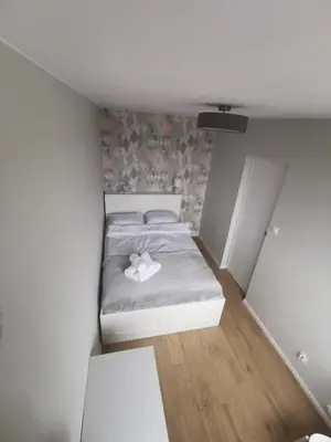 Łóżko lub łóżka w pokoju w obiekcie Apartament Manhattan