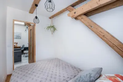 Łóżko lub łóżka w pokoju w obiekcie Apartament Mikołowska
