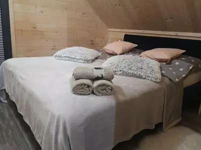 Łóżko lub łóżka w pokoju w obiekcie Domek Nasze Miejsce