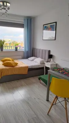 Łóżko lub łóżka w pokoju w obiekcie NightHost Kleczkowska 49 m53 Wrocław